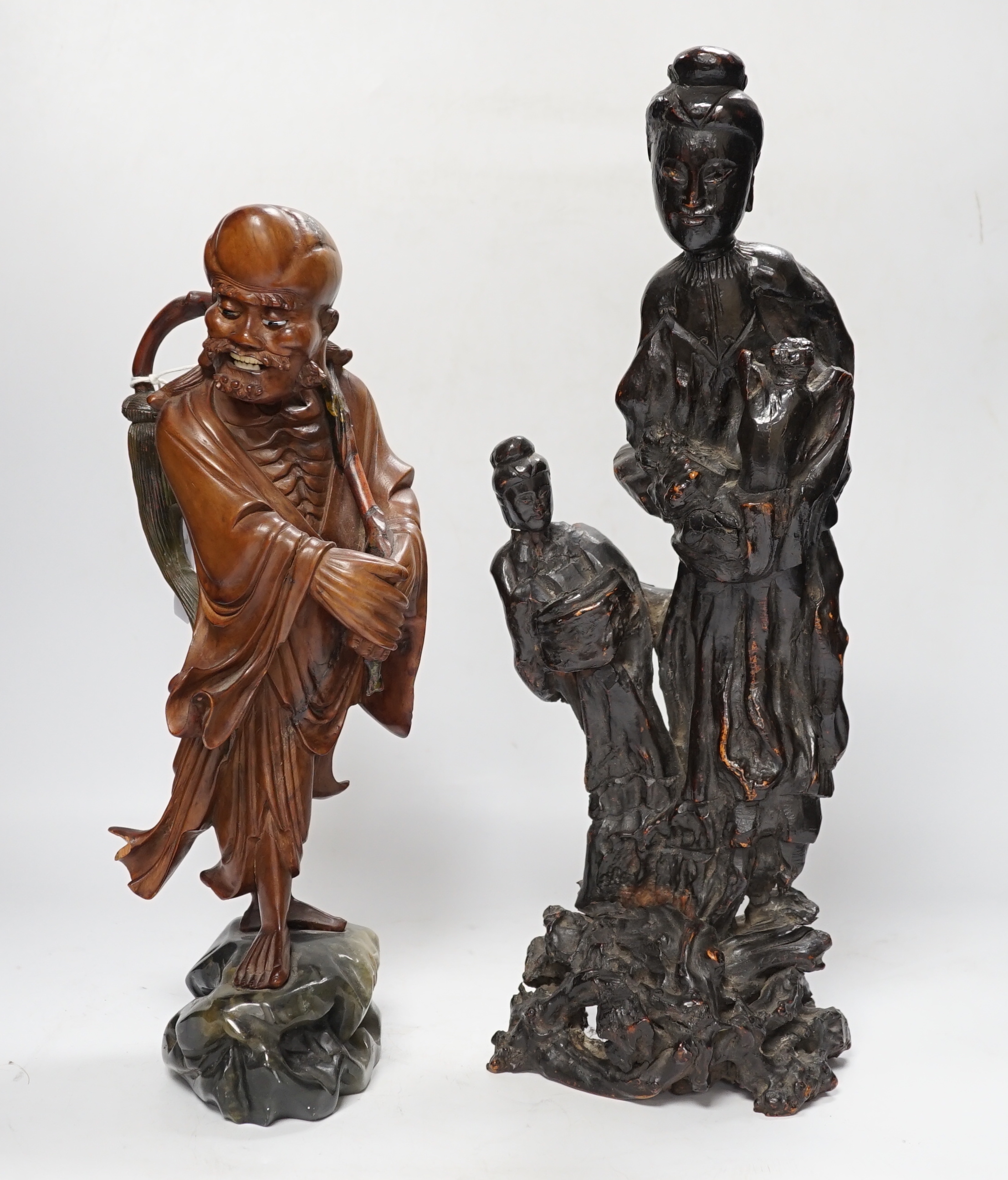 A Chinese root wood carving of two females, 42cm, and an early 20th century Chinese root carving of an immortal, on soapstone base, 36cm tall